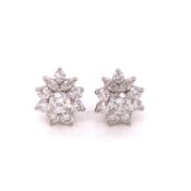 A PAIR OF TIFFANY AND CO VINTAGE PLATINUM AND DIAMOND ASYMMETRIC CLUSTER STUD EARRINGS, WITH
