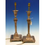 A PAIR OF SILVER HALLMARKED REGENCY STYLE CANDLESTICKS LATER ADAPTED FOR ELECTRICITY, HEIGHT 32cms