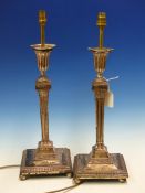 A PAIR OF SILVER HALLMARKED REGENCY STYLE CANDLESTICKS LATER ADAPTED FOR ELECTRICITY, HEIGHT 32cms