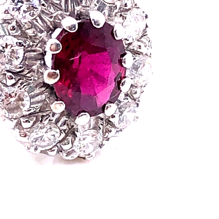 AN 18ct WHITE GOLD RUBY AND DIAMOND CLUSTER RING. THE OVAL CLAW SET RUBY SURROUNDED BY A CLUSTER - Image 7 of 18