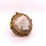 A FINE VICTORIAN GOLD MOUNTED AND DIAMOND SET DEEP RELIEF CARVED CHALCEDONY CAMEO BROOCH. DIAMETER