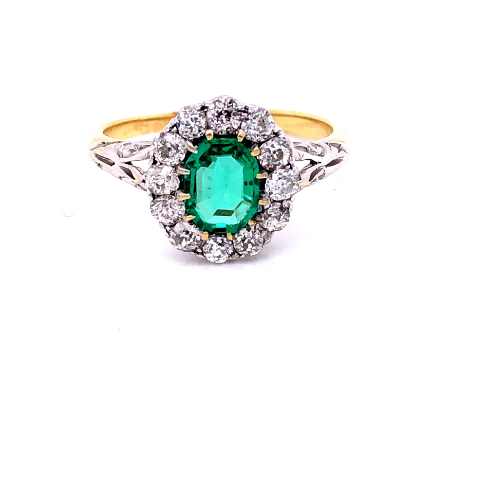 AN EMERALD AND DIAMOND CLUSTER RING. THE PRINCIPLE MIXED CUT EMERALD IN A TWELVE CLAW SETTING - Image 6 of 17