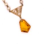 A 9ct GOLD CITRINE AND GRADUATED PEARL DROP PENDANT. WITH AN OPEN WORK PANEL. LENGTH 41cms, WEIGHT