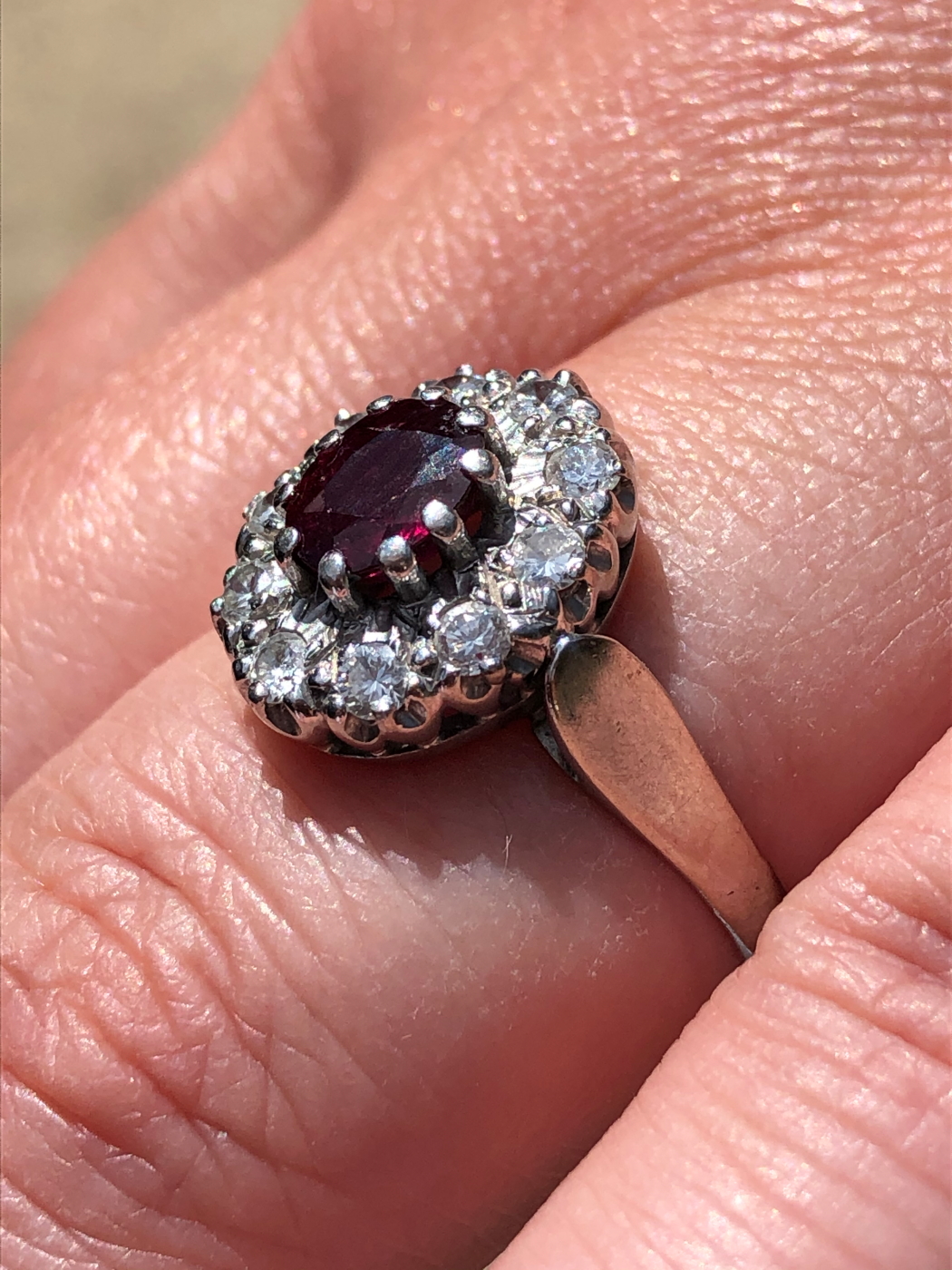 AN 18ct WHITE GOLD RUBY AND DIAMOND CLUSTER RING. THE OVAL CLAW SET RUBY SURROUNDED BY A CLUSTER - Image 12 of 18