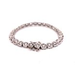 A 14ct WHITE GOLD ART DECO DIAMOND BRACELET, COMPLETE WITH SAFETY CHAIN. GROSS WEIGHT 12.7grms.