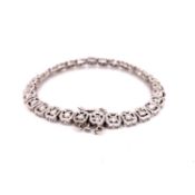 A 14ct WHITE GOLD ART DECO DIAMOND BRACELET, COMPLETE WITH SAFETY CHAIN. GROSS WEIGHT 12.7grms.