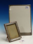 TWO HALLMARKED SILVER PHOTO FRAMES. 32cms X 23cms, AND 16.5cms X 12.5cms.