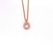 AN 18ct YELLOW GOLD DIAMOND AND PEARL PENDANT. THE CULTURED PEARL SURROUNDED BY A HALO OF