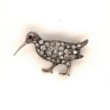 A VICTORIAN PAVE SET DIAMOND WOODCOCK BROOCH WITH A RUBY CABOCHON EYE. MEASUREMENTS 3.1cms x 1.