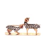 A LATE GEORGIAN 15ct GOLD BROOCH DEPICTING TWO DIAMOND SET DEER ONE CROUCHING THE OTHER STANDING,