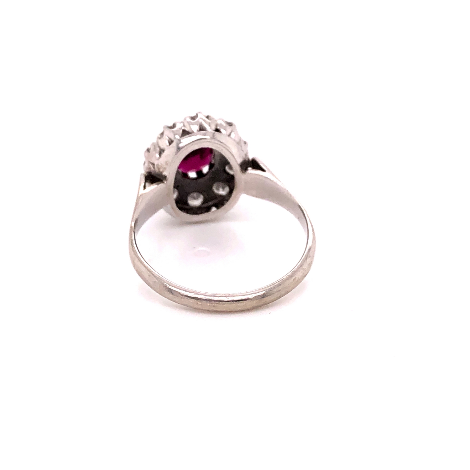 AN 18ct WHITE GOLD RUBY AND DIAMOND CLUSTER RING. THE OVAL CLAW SET RUBY SURROUNDED BY A CLUSTER - Image 3 of 18