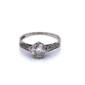 18ct WHITE GOLD AND PLATINUM DIAMOND SINGLE STONE WITH DIAMOND SET SHOULDERS. CENTRE STONE ESTIMATED