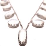 A 20th C. SILVER AND MOONSTONE MULTI GRADUATED DROP NECKLACE, LENGTH 44cms, WEIGHT 16.4grms.