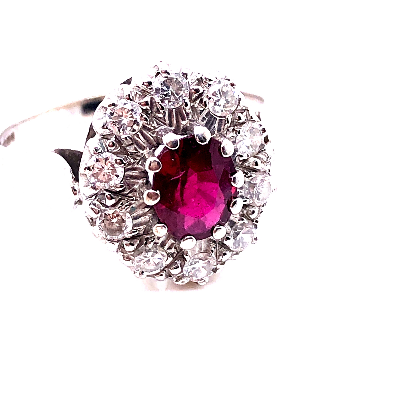 AN 18ct WHITE GOLD RUBY AND DIAMOND CLUSTER RING. THE OVAL CLAW SET RUBY SURROUNDED BY A CLUSTER - Image 17 of 18
