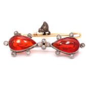 A FIRE OPAL AND DIAMOND BROOCH, THE TWO MATCHING FIRE OPALS ARE PEAR CUT IN A RUBOVER SETTING