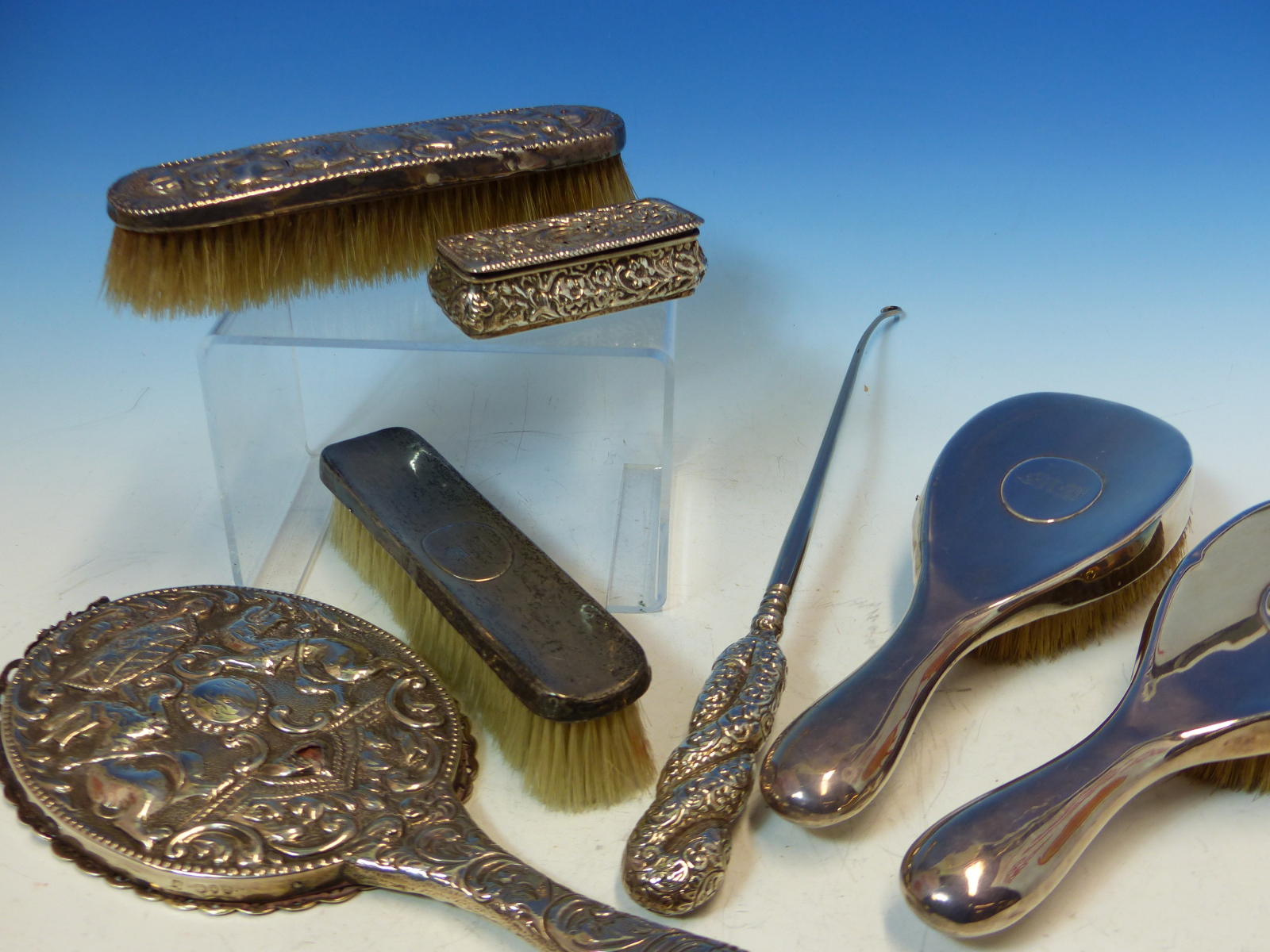 A HALLMARKED SILVER THREE PIECE DRESSING TABLE SET, A FURTHER REPOUSSE DECORATED MIRROR AND BRUSH, A - Image 2 of 8