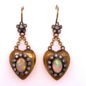 VICTORIAN OPAL AND DIAMOND PUFFED HEART ARTICULATED DROP EARRINGS ON GOLD WIRES. THE CENTRAL OPALS