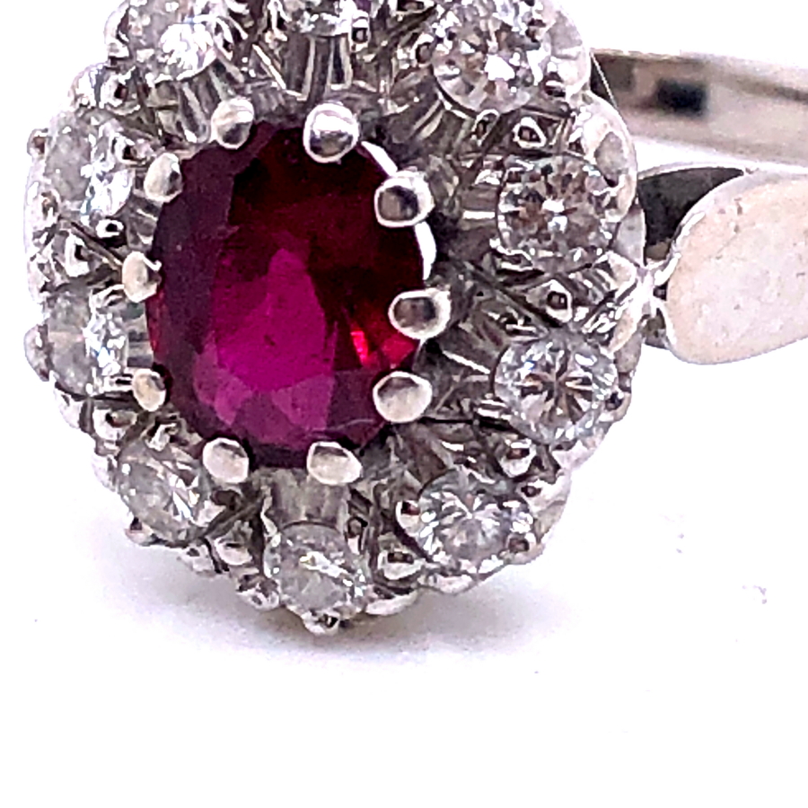 AN 18ct WHITE GOLD RUBY AND DIAMOND CLUSTER RING. THE OVAL CLAW SET RUBY SURROUNDED BY A CLUSTER - Image 8 of 18