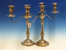 A PAIR OF GEORGIAN CANDELABRA THE SILVER BASES HALLMARKED FOR NATHANIEL SMITH & CO, SHEFFIELD