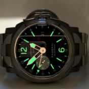 A PANERAI LUMINOR GMT AUTOMATIC WRIST WATCH. BLACK DIAL, TITANIUM CASE AND STAINLESS STEEL BI-