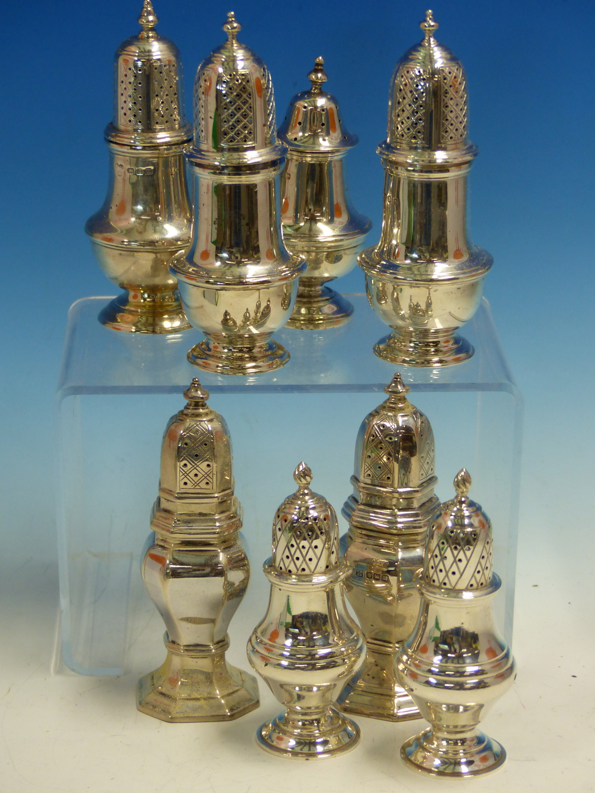 THREE PAIRS OF VINTAGE HALLMARKED SILVER TABLE PEPPERS AND TWO FURTHER SINGLE EXAMPLES.