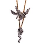 A VICTORIAN DIAMOND SET BIRD AND SNAKE SYMBOLIC PENDANT ON A GOLD FANCY LINK LARIAT SLIDER. LENGTH