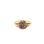 AN ANTIQUE EMERALD, RUBY AND DIAMOND SWEETHEART RING. THE DOUBLE GEM SET HEARTS UNDER A DIAMOND