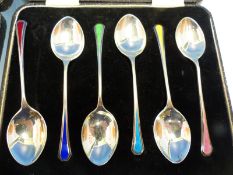 A SET OF SIX HALLMARKED SIVER AND ENAMEL CASED COFFEE SPOONS, A FURTHER SET OF SIX, PART SET OF FIVE