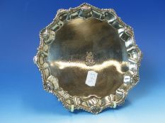 A 18th C. HALLMARKED SILVER SALVER WITH A SHELL BORDER AND A DRAGON CREST, MARKS FOR RICHARD RUGG,