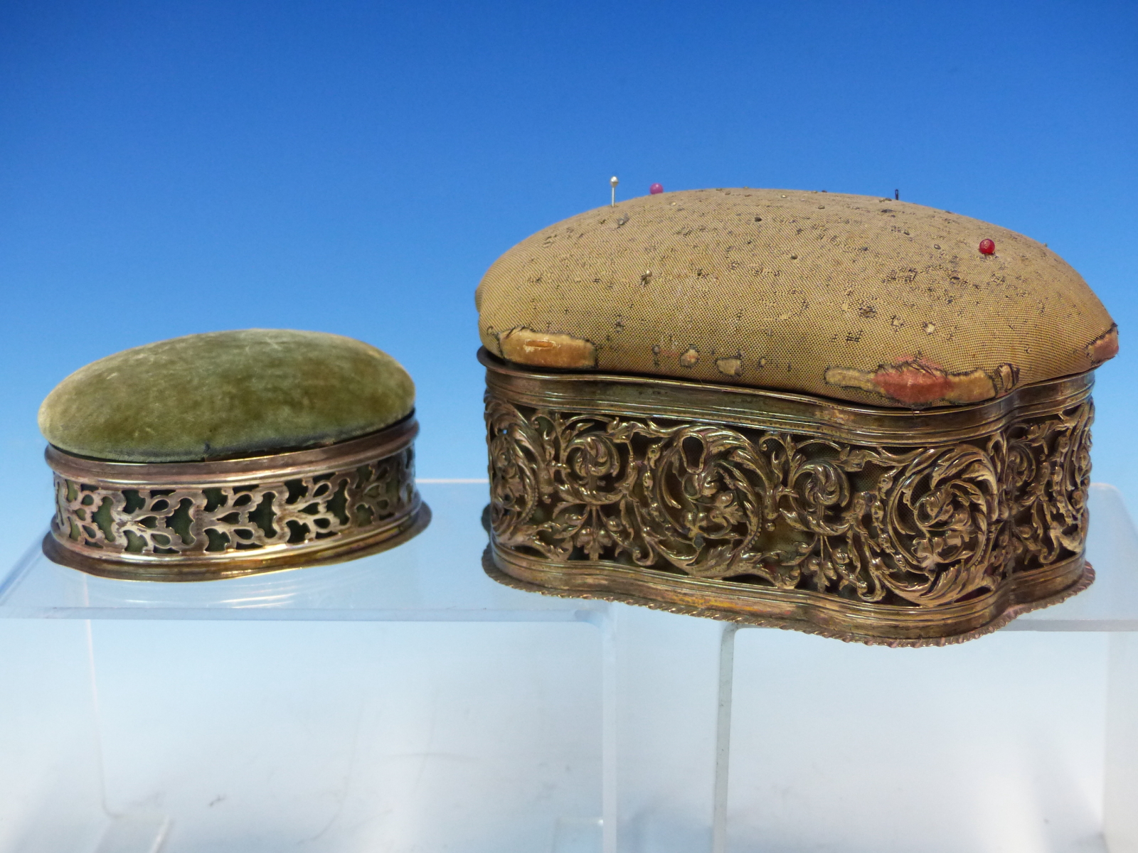 A VELVET PIN CUSHION WITH PIERCED SILVER BORDER HALLMARKED BIRMINGHAM DATED 1901,TOGETHER WITH A