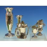 A SILVER HALLMARKED BUD VASE WITH LOADED BASE, TOGETHER WITH ANOTHER, A TWO HANDLED LOVING CUP,