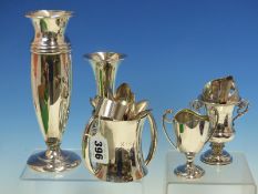 A SILVER HALLMARKED BUD VASE WITH LOADED BASE, TOGETHER WITH ANOTHER, A TWO HANDLED LOVING CUP,