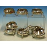 A SET OF EIGHT SILVER HALLMARKED SALTS AND ASSOCIATED SPOONS, VARIOUSLY DATED TO INCLUDE 1827 ETC,