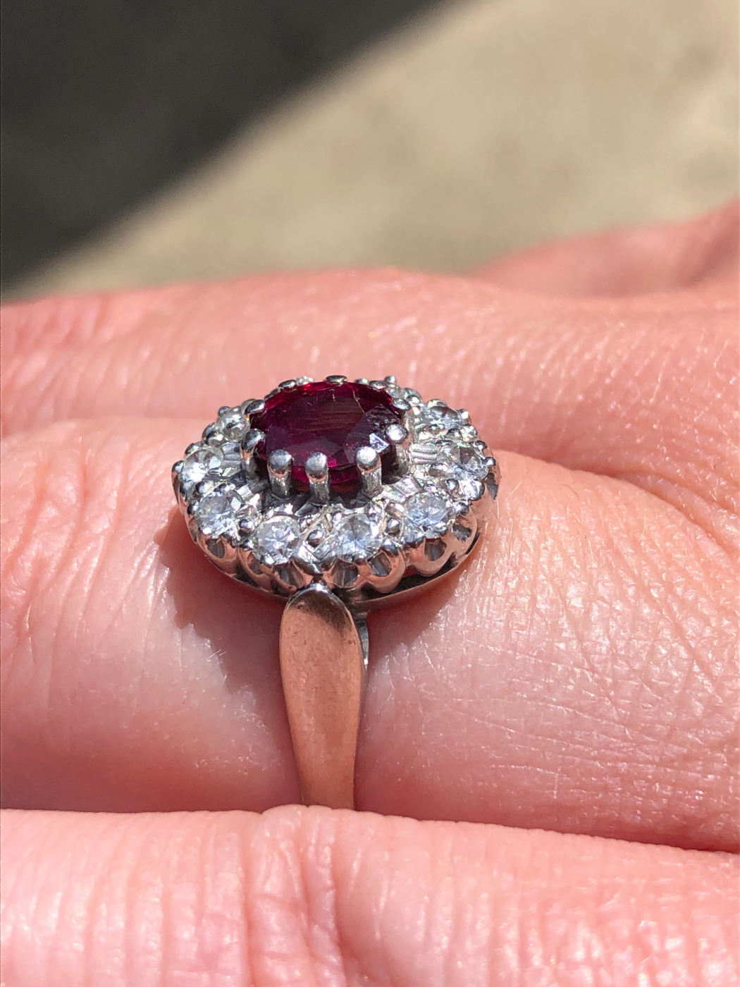 AN 18ct WHITE GOLD RUBY AND DIAMOND CLUSTER RING. THE OVAL CLAW SET RUBY SURROUNDED BY A CLUSTER - Image 13 of 18