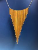 AN 18ct GOLD GRADUATED ARTICULATED FRINGE PENDANT NECKLACE COMPLETE WITH MATCHING 18ct GOLD