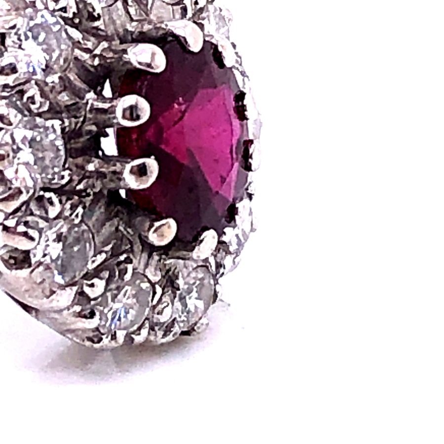 AN 18ct WHITE GOLD RUBY AND DIAMOND CLUSTER RING. THE OVAL CLAW SET RUBY SURROUNDED BY A CLUSTER - Image 6 of 18