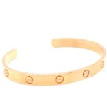 A LADIES 18ct. ROSE GOLD CARTIER TORQUE LOVE BANGLE. SIZE 19. REF NUMBER BAS234. WEIGHT 24.7grms.