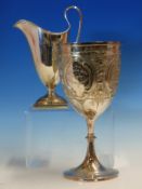 A HALLMARKED SILVER HELMET FORM CREAM JUG WITH ARMORIAL ENGRAVED CREST dated 1903 CHESTER TOGETHER