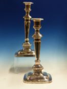 A PAIR OF TALL PLAIN RECTANGULAR WEIGHTED CANDLESTICKS WITH GADROON BORDERS, DATED SHEFFIELD 1929,