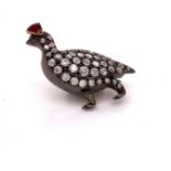 A EARLY 20th C. DIAMOND AND ENAMEL SET GROUSE BROOCH. MEASUREMENTS 3.3cms X 2.6cms, WEIGHT 9.3grms.