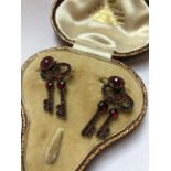 A PAIR OF ANTIQUE BOHEMIAN GARNET SET DOUBLE KEY ARTICULATED EARRINGS FINISHED ON EARRING WIRES.