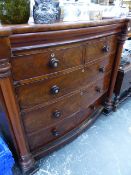 A VICTORIAN MAHOGANY BOW FRONT CHEST OF DRAWERS.