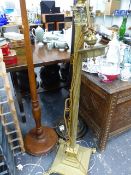 AN ANTIQUE BRASS STANDARD LAMP AND TWO OTHERS.