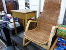 A RETRO RATTAN ARMCHAIR AND A CHILD'S DESK.