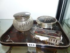 A SILVER MOUNTED TORTOISESHELL DRESSING TABLE SET.