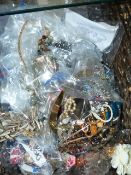 A LARGE BASKET OF COSTUME JEWELLERY.