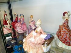 SEVEN VARIOUS DOULTON FIGURINES.