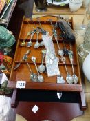 A QTY OF COLLECTOR'S SPOONS.