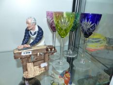 A ROYAL DOULTON FIGURE OF THE CARPENTER AND A SET OF FOUR HOCK GLASSES.