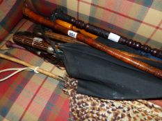 VARIOUS WALKING STICKS AND UMBRELLAS.